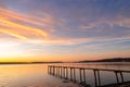 Pier and bridge on the sea, beautiful sunset, dramatic sky background Royalty Free Stock Photo