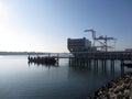 Pier and Cargo Boat Sits in Oakland Harbor Royalty Free Stock Photo