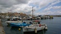 The pier in the city of Chania with lots of boats in cloudy weather