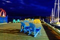 Pier with colorful chairs at night in Lunenburg Harbor