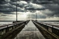 Pier covered in water on the sea under a cloudy sky in the evening - perfect for backgrounds Royalty Free Stock Photo