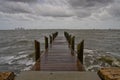 Pier on a Dark and Stormy Afternoon - Horizontal Royalty Free Stock Photo