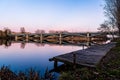Pier and Enrique Estevan Iron Bridge reflected on the Tormes River at sunset Royalty Free Stock Photo