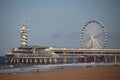 Pier and Ferris wheel at the beach of Scheveningen close to The Hague on the North sea beach.