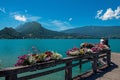 Pier with flowers on the lake of Annecy, in the village of Talloires. Royalty Free Stock Photo
