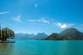 Pier with flowers on the lake of Annecy, in the village of Talloires. Royalty Free Stock Photo