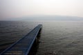 Pier on a foggy cloudy day.