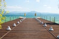 Pier at Sirmione, Garda lake, with Beach Umbrella. Royalty Free Stock Photo