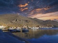 a pier in greece before sunset begins