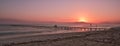 Pier/jetty playa de muro, alcudia, mallorca, spain, sunrise over mountains, secluded beach Royalty Free Stock Photo