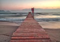 Pier / jetty playa de muro, alcudia, sunrise, mountains, secluded beach, mallorca, spain Royalty Free Stock Photo