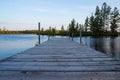 Pier jutting out into the Chippewa Flowage as sun begins to set in the Northwoods