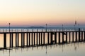 Pier on a lake with beautiful reflections and sunset colors Royalty Free Stock Photo