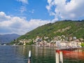 a pier on the lake with hotels in italy Royalty Free Stock Photo