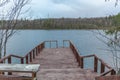 Pier on the lake. Sami, saami village on the Kola Peninsula, Russia. Tourist ethnographic parking. Settlement Old Titovka, Royalty Free Stock Photo