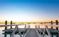 Pier leading into bay of Tauranga harbor at sunrise