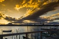 Pier located on Ilha das Caieiras in the municipality of Vitoria, showing sunset and clouds in a spiral shape