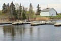 A pier with moored boats. Small white house on the shore Royalty Free Stock Photo