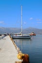 Pier with moored yacht at the port of Nafplion, Greece