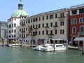Pier with motor boats on the water near ancient houses in Venice, Italy. Historical monument of the Middle Ages Royalty Free Stock Photo