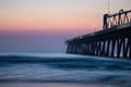 Pier near the calm sea under the beautiful sunset sky Royalty Free Stock Photo