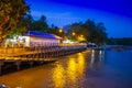 Pier at night with yellow lights on a background of blue sky Royalty Free Stock Photo