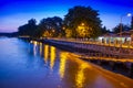 Pier at night with yellow lights on a background of blue sky Royalty Free Stock Photo