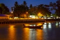 Pier at night with yellow lights on a background of blue sky Royalty Free Stock Photo