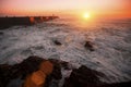 Pier in the Ocean, during amazing bloody sunset. Nature.