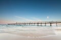 Pier on the ocean with rushing wave Royalty Free Stock Photo