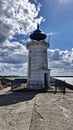 The pier with the old Genoese lighthouse in Mangalia Royalty Free Stock Photo