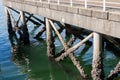 Pier with old rusty concrete pillars by the sea Royalty Free Stock Photo