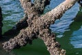 Pier with old rusty concrete pillars by the sea Royalty Free Stock Photo