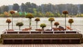 Pier Park at the riverfront of Fraser River in New Westminster City.Promenade with flowers and wooden salmon decoration