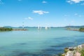 Sailboats sail along the piers of Balatonlelle at Lake Balaton Royalty Free Stock Photo