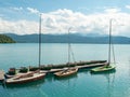 Pier with rental row boats and yachts at mountain lake Walchensee Royalty Free Stock Photo