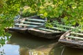 Pier with rowboats in the Green Venice of the Marais Poitevin France Royalty Free Stock Photo