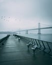 Pier 14 and the San Francisco Ã¢â¬â Oakland Bay Bridge on a rainy evening, San Francisco, California