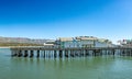 pier in Santa Barbara - Stearns wharf - with empty beach in midday heat Royalty Free Stock Photo