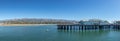 pier in Santa Barbara - Stearns wharf - with empty beach in midday heat Royalty Free Stock Photo