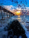 Pier seen through wave splash