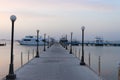 Pier and ships on the sea. The pre-dawn sky. A minute before sunrise. Red sea, Egypt Royalty Free Stock Photo