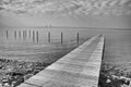 Pier on the shores of the Baltic Sea with visible Oresund bridge