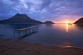Pier and silend sea at the sunrise in the sandy beaches of Adrasan with a mountain view