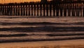 Pier silhouette at sunset, California USA, Oceanside. Surfing resort, ocean tropical beach. Surfer waiting for wave. Royalty Free Stock Photo