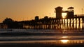 Pier silhouette at sunset, California USA, Oceanside. Surfing resort, ocean tropical beach. Surfer waiting for wave. Royalty Free Stock Photo