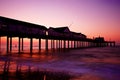 Pier silhouetted at sunset Royalty Free Stock Photo