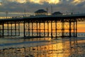 Pier or jetty, colourful sunrise. Cromer. UK.