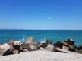 Pier of the town of Pomorie / Bulgaria, covered with breakwaters around, which protects the beach and the city from strong waves. Royalty Free Stock Photo