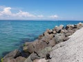 Pier of the town of Pomorie / Bulgaria, covered with breakwaters around, which protects the beach and the city from strong waves. Royalty Free Stock Photo